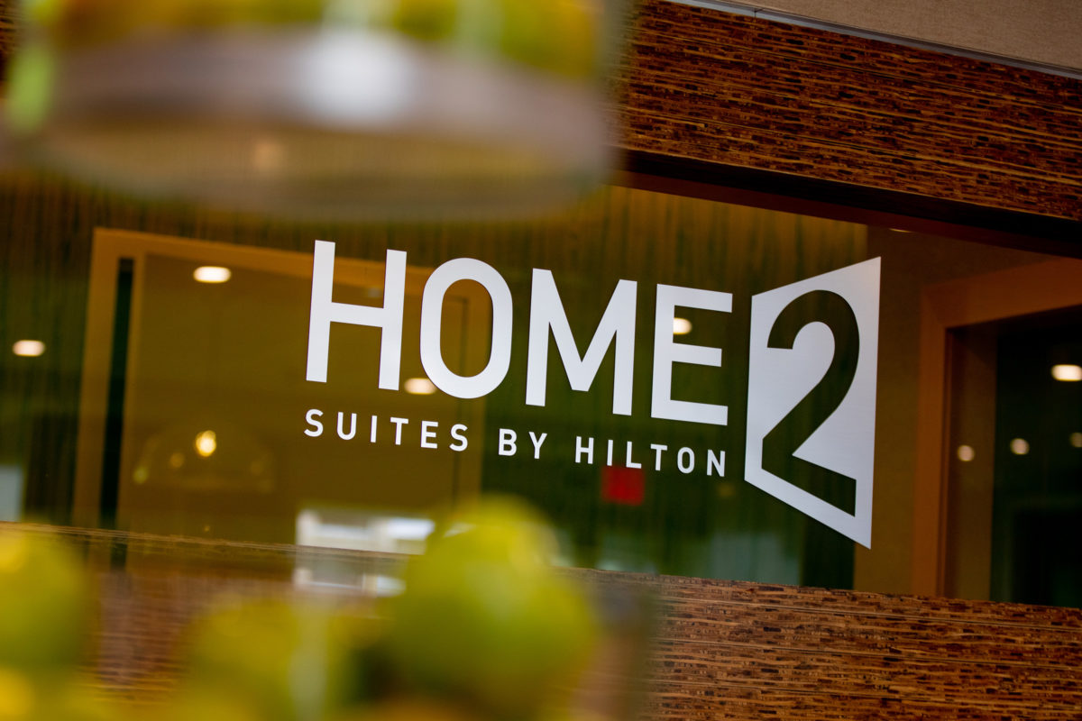 Logo of HOME2 SUITES SILVER SPRING on window of hotel