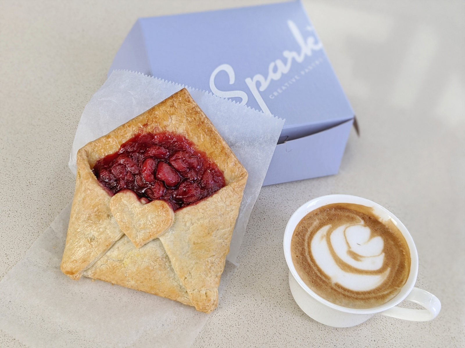 Cute valentine's day baked good and cup of coffee from Spark'd