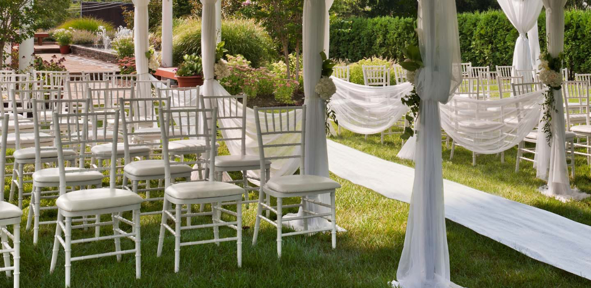 Outdoor wedding at Westminster Hotel with seating arrangement and aisle