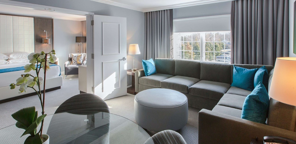 One bedroom suite at the Westminster hotel with sofa and king bed