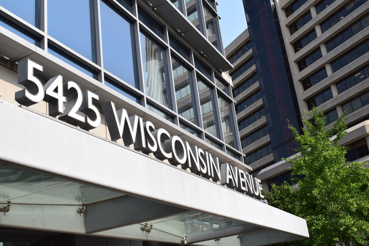 Exterior of building with address sign 5425 Wisconsin Ave at Support Center