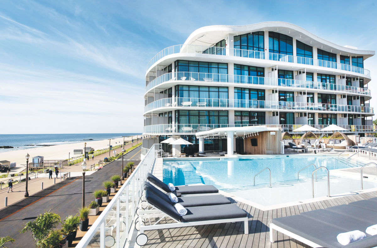 Exterior of Wave Resort with view of pool and beach